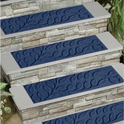 Aqua Shield Brittney Leaf Navy 8.5 in. X 30 in. PET Polyester Indoor Outdoor Stair Tread Covers (Set of 4) by Bungalow Flooring -Bungalow Flooring Store navy bungalow flooring stair tread covers 20562611 31 1000